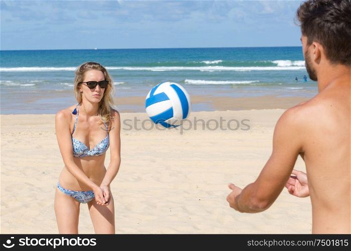 friends playing beach volleyball sport