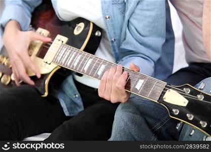 friends playing guitar