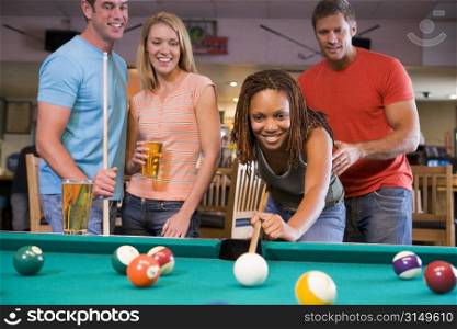 Friends playing pool