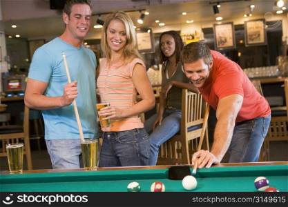 Friends playing pool