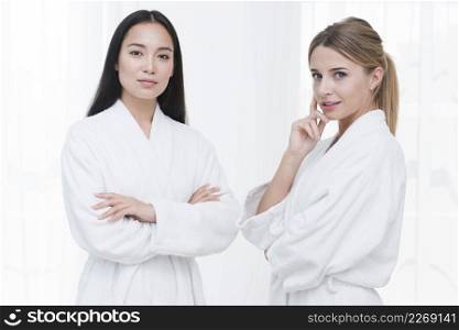 friends posing with bathrobe spa