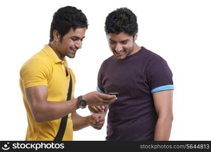 Friends reading text message on cell phone over white background