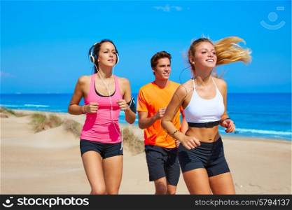 friends running on the beach happy in summer sunny day