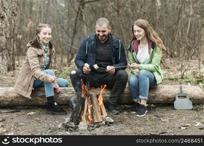 friends sitting bonfire