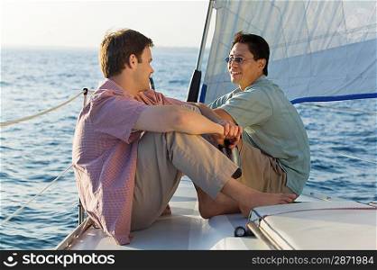 Friends Sitting on Sailboat