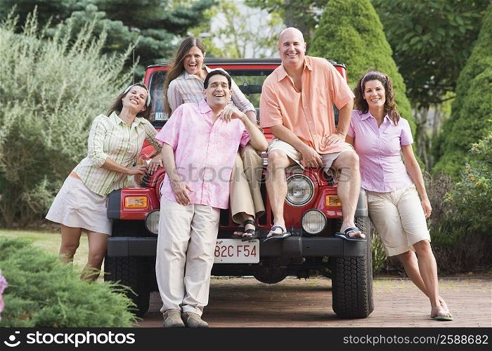 Friends smiling on a car