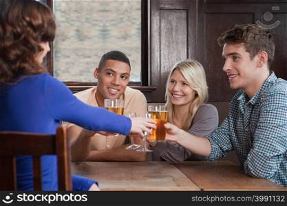 Friends toasting in bar