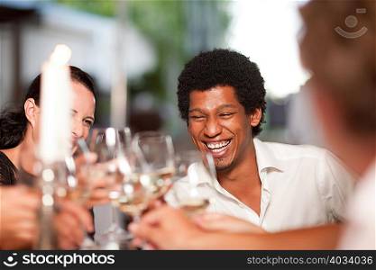 Friends toasting in restaurant