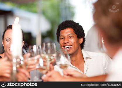Friends toasting in restaurant