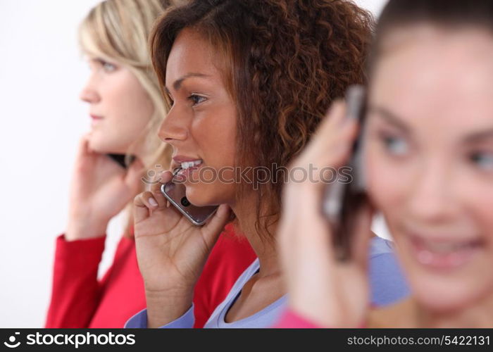 Friends using mobile telephones