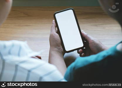 Friends watching social media in a smart phone. social network concept with smart phone. white screen for mockup