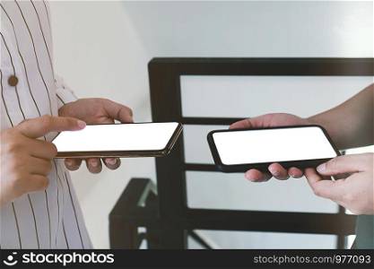 Friends watching social media in a smart phone. social network concept with smart phone. white screen for mockup