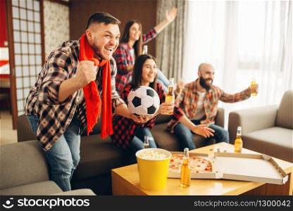 Friends wathing tv broadcast at home, football fans. Group of people cheer for their favorite team, decisive match. Cheerful company celebrate goal. Friends cheer for favorite team, football fans