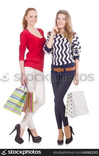 Friends with shopping bags isolated on white