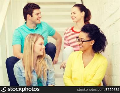 friendship and education concept - smiling teenagers hanging out