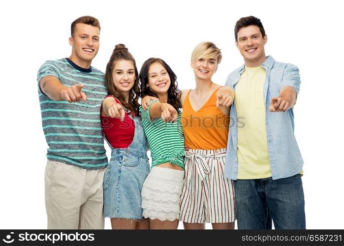 friendship and people concept - group of happy smiling friends hugging over white background pointing at you. happy friends hugging and pointing at you