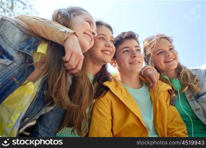 friendship and people concept - group of happy teenage students or friends outdoors. happy teenage students or friends outdoors