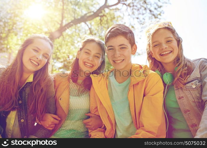 friendship and people concept - group of happy teenage students or friends outdoors. happy teenage students or friends outdoors