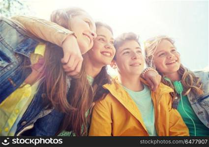friendship and people concept - group of happy teenage students or friends outdoors. happy teenage students or friends outdoors. happy teenage students or friends outdoors