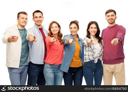 friendship and people concept - group of smiling friends pointing at you over white background. group of smiling friends pointing at you over