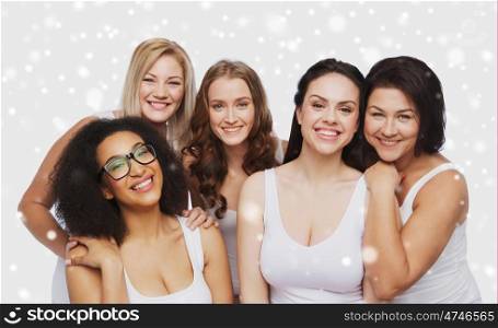 friendship, beauty, body positive and people concept - group of different happy women in white underwear over snow