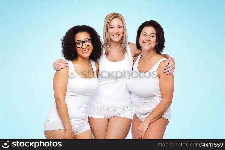 friendship, beauty, body positive and people concept - group of happy plus size women in white underwear over blue background