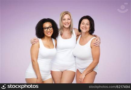friendship, beauty, body positive and people concept - group of happy plus size women in white underwear over violet background