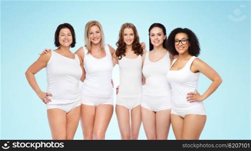 friendship, beauty, body positive and people concept - group of happy women different in white underwear over blue background