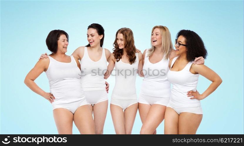 friendship, beauty, body positive and people concept - group of happy women different in white underwear over blue background