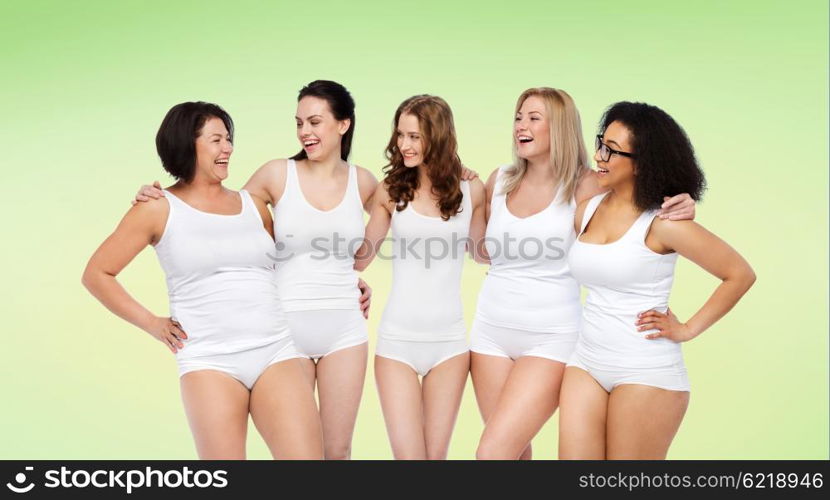 friendship, beauty, body positive and people concept - group of happy women different in white underwear over green natural background