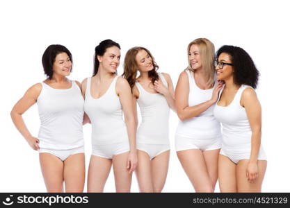 friendship, beauty, body positive and people concept - group of happy women different in white underwear