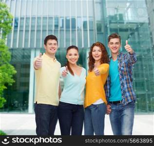 friendship, business, education and people concept - group of smiling teenagers showing thumbs up over campus background