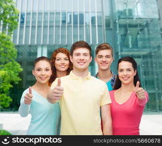 friendship, city life, business and people concept - group of smiling teenagers over city background