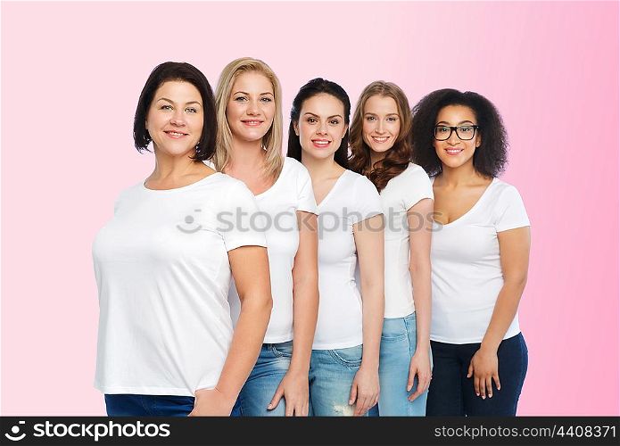 friendship, diverse, body positive and people concept - group of happy different size women in white t-shirts over pink background