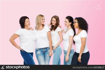 friendship, diverse, body positive and people concept - group of happy different size women in white t-shirts hugging over pink background