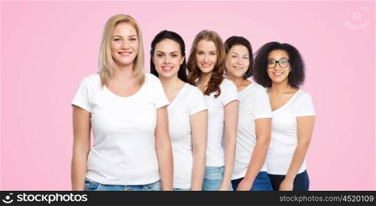 friendship, diverse, body positive and people concept - group of happy different size women in white t-shirts over pink background