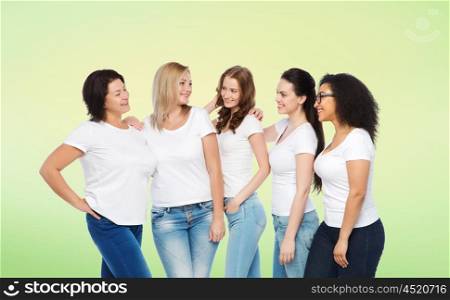 friendship, diverse, body positive and people concept - group of happy different size women in white t-shirts hugging over green natural background
