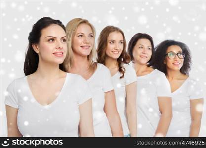 friendship, diverse, body positive and people concept - group of happy different size women in white t-shirts over snow
