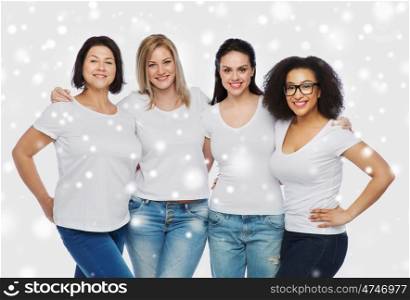 friendship, diverse, body positive and people concept - group of happy different size women in white t-shirts hugging over snow