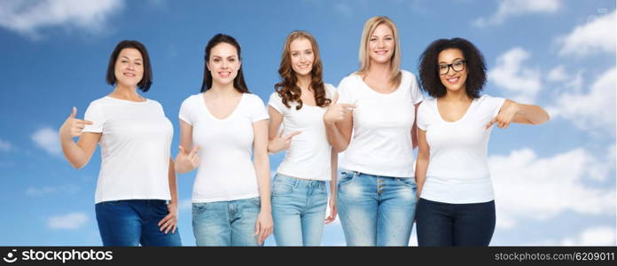 friendship, diverse, body positive and people concept - group of happy different size women in white t-shirts pointing finger to themselves over blue sky and clouds background