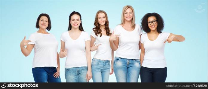 friendship, diverse, body positive and people concept - group of happy different size women in white t-shirts pointing finger to themselves over blue background