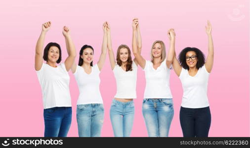 friendship, diverse, body positive and people concept - group of happy different size women in white t-shirts holding hands up over pink background