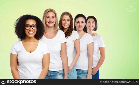 friendship, diverse, body positive and people concept - group of happy different size women in white t-shirts over green natural background