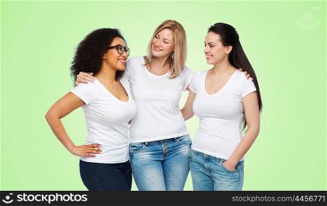 friendship, diverse, body positive, communication and people concept - group of happy different size women in white t-shirts hugging and talking over green natural background