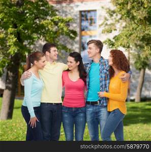 friendship, education, summer vacation and people concept - group of smiling teenagers standing and hugging over campus background