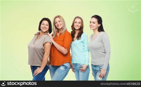 friendship, fashion, body positive, diverse and people concept - group of happy different size women in casual clothes over green natural background