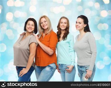 friendship, fashion, body positive, diverse and people concept - group of happy different size women in casual clothes over blue holidays lights background