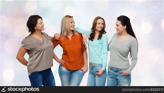 friendship, fashion, body positive, diverse and people concept - group of happy different size women in casual clothes over holidays lights background