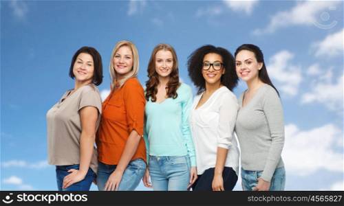 friendship, fashion, body positive, diverse and people concept - group of happy different size women in casual clothes over blue sky and clouds background