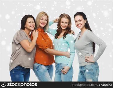 friendship, fashion, body positive, diverse and people concept - group of happy different size women in casual clothes over snow